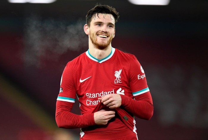 LIVERPOOL, ENGLAND - DECEMBER 06: Andy Robertson of Liverpool reacts during the Premier League match between Liverpool and Wolverhampton Wanderers at Anfield on December 06, 2020 in Liverpool, England. A limited number of fans (2000) are welcomed back to stadiums to watch elite football across England. This was following easing of restrictions on spectators in tiers one and two areas only. (Photo by Peter Powell - Pool/Getty Images)