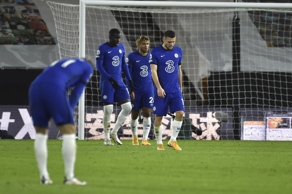 Chelsea players react after Wolverhampton Wanderers' Pedro Neto scores during the English Premier League soccer match between Wolverhampton Wanderers and Chelsea at the Molineux Stadium in Wolverhampton, England, Tuesday, Dec. 15, 2020. (AP Photo/Rui Vieira, Pool)