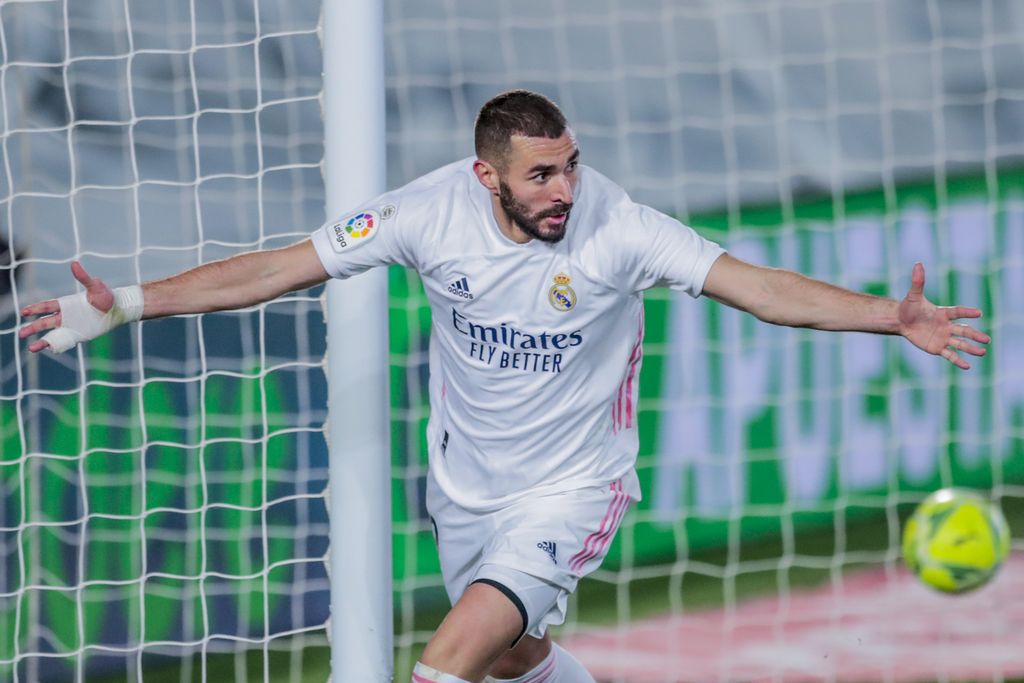 Real Madrid's Karim Benzema celebrates after scoring his side's second goal during the Spanish La Liga soccer match between Real Madrid and Athletic Club Bilbao at the Alfredo Di Stefano stadium in Madrid, Spain, Tuesday, Dec. 15, 2020. (AP Photo/Bernat Armangue)