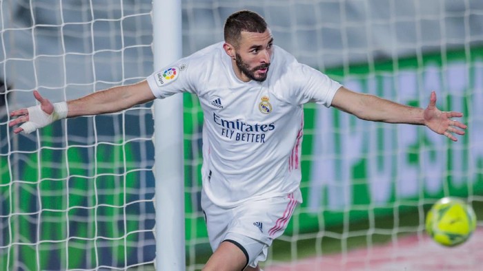 Real Madrids Karim Benzema celebrates after scoring his sides second goal during the Spanish La Liga soccer match between Real Madrid and Athletic Club Bilbao at the Alfredo Di Stefano stadium in Madrid, Spain, Tuesday, Dec. 15, 2020. (AP Photo/Bernat Armangue)