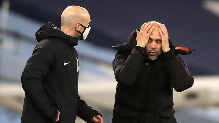 MANCHESTER, ENGLAND - DECEMBER 15: Pep Guardiola, Manager of Manchester City argues with fourth official Anthony Taylor during the Premier League match between Manchester City and West Bromwich Albion at Etihad Stadium on December 15, 2020 in Manchester, England. The match will be played without fans, behind closed doors as a Covid-19 precaution.  (Photo by Martin Rickett - Pool/Getty Images)