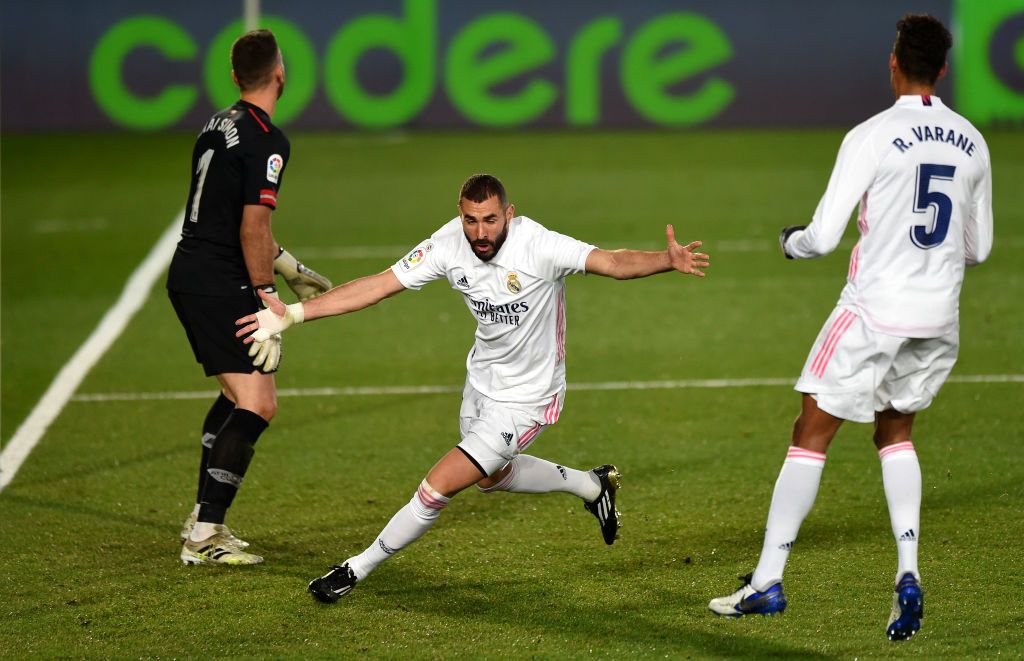 MADRID, SPAIN - DECEMBER 15: Karim Benzema of Real Madrid celebrates after scoring his sides second goal during the La Liga Santander match between Real Madrid and Athletic Club at Estadio Alfredo Di Stefano on December 15, 2020 in Madrid, Spain. Sporting stadiums around Spain remain under strict restrictions due to the Coronavirus Pandemic as Government social distancing laws prohibit fans inside venues resulting in games being played behind closed doors.  (Photo by Denis Doyle/Getty Images)