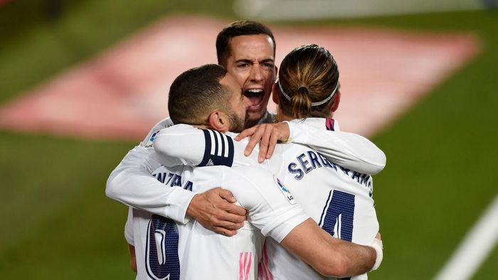Real Madrid MADRID, SPAIN - DECEMBER 15: Karim Benzema of Real Madrid celebrates with Sergio Ramos and Marco Asensio after scoring his sides second goal during the La Liga Santander match between Real Madrid and Athletic Club at Estadio Alfredo Di Stefano on December 15, 2020 in Madrid, Spain. Sporting stadiums around Spain remain under strict restrictions due to the Coronavirus Pandemic as Government social distancing laws prohibit fans inside venues resulting in games being played behind closed doors. (Photo by Denis Doyle/Getty Images)