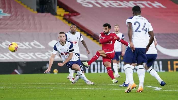 Mohamed Salah LIVERPOOL, ENGLAND - DECEMBER 16: Mohamed Salah of Liverpool shoots past Eric Dier of Tottenham Hotspur during the Premier League match between Liverpool and Tottenham Hotspur at Anfield on December 16, 2020 in Liverpool, England. A limited number of fans (2000) are welcomed back to stadiums to watch elite football across England. This was following easing of restrictions on spectators in tiers one and two areas only. (Photo by Jon Super - Pool/Getty Images)