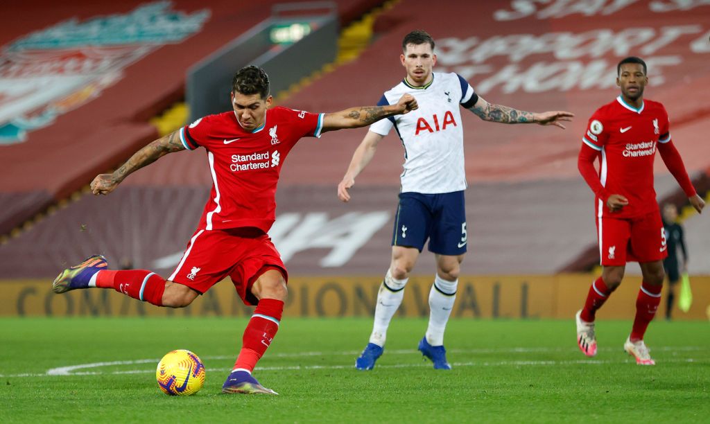 LIVERPOOL, ENGLAND - DECEMBER 16:Roberto Firmino of Liverpool celebrates after scoring their team's second goal during the Premier League match between Liverpool and Tottenham Hotspur at Anfield on December 16, 2020 in Liverpool, England. A limited number of fans (2000) are welcomed back to stadiums to watch elite football across England. This was following easing of restrictions on spectators in tiers one and two areas only. (Photo by Clive Brunskill/Getty Images)