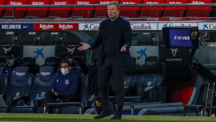 Barcelonas head coach Ronald Koeman gives instruction inside the box team area during the Spanish La Liga soccer match between FC Barcelona and Real Sociedad at the Camp Nou stadium in Barcelona, Spain, Wednesday, Dec. 16, 2020. (AP Photo/Joan Monfort)