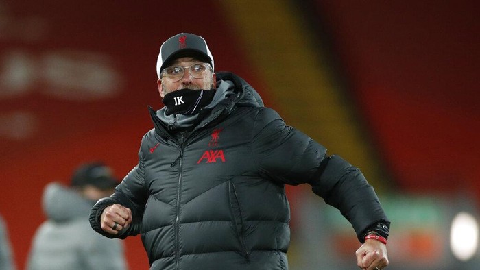 Liverpools manager Jurgen Klopp celebrates towards the fans after the end of the English Premier League soccer match between Liverpool and Tottenham Hotspur at Anfield in Liverpool, England, Wednesday, Dec., 16, 2020. Liverpool won the game 2-1. (Clive Brunskill/ Pool via AP)