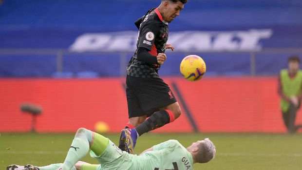Liverpool's Roberto Firmino, top, scores his side's fifth goal during the English Premier League soccer match between Crystal Palace and Liverpool at Selhurst Park stadium in London, Saturday, Dec. 19, 2020. (Justin Setterfield/Pool via AP)