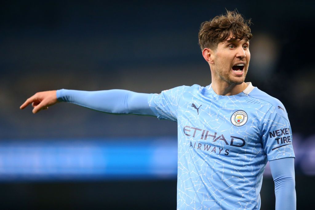 MANCHESTER, ENGLAND - DECEMBER 05: John Stones of Manchester City gives his team instructions during the Premier League match between Manchester City and Fulham at Etihad Stadium on December 05, 2020 in Manchester, England. The match will be played without fans, behind closed doors as a Covid-19 precaution. (Photo by Alex Livesey/Getty Images)