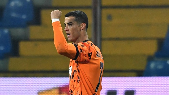 PARMA, ITALY - DECEMBER 19:  Cristiano Ronaldo of Juventus F.C.  celebrates after scoring their teams third goal during the Serie A match between Parma Calcio and Juventus at Stadio Ennio Tardini on December 19, 2020 in Parma, Italy. Sporting stadiums around Italy  remain under strict restrictions due to the Coronavirus Pandemic as Government social distancing laws prohibit fans inside venues resulting in games being played behind closed doors. (Photo by Alessandro Sabattini/Getty Images)