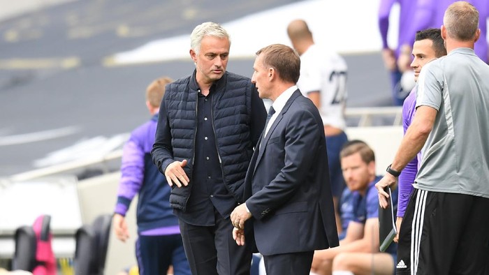 LONDON, ENGLAND - JULY 19: Jose Mourinho, Manager of Tottenham Hotspur speaks with Brendan Rodgers, Manager of Leicester City after the Premier League match between Tottenham Hotspur and Leicester City at Tottenham Hotspur Stadium on July 19, 2020 in London, England. Football Stadiums around Europe remain empty due to the Coronavirus Pandemic as Government social distancing laws prohibit fans inside venues resulting in all fixtures being played behind closed doors. (Photo by Michael Regan/Getty Images)