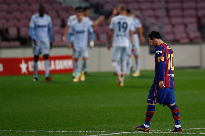 BARCELONA, SPAIN - DECEMBER 19: Lionel Messi of FC Barcelona looks dejected as his side concede a second goal during the La Liga Santander match between FC Barcelona and Valencia CF at Camp Nou on December 19, 2020 in Barcelona, Spain.Sporting stadiums around Spain remain under strict restrictions due to the Coronavirus Pandemic as Government social distancing laws prohibit fans inside venues resulting in games being played behind closed doors. (Photo by Eric Alonso/Getty Images)