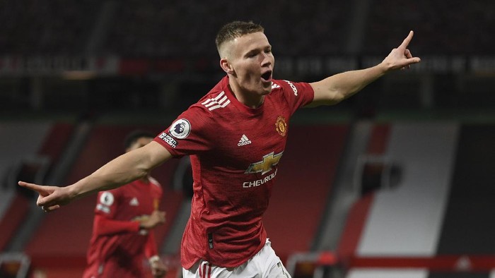 Manchester Uniteds Scott McTominay celebrates his sides second goal during an English Premier League soccer match between Manchester United and Leeds United at the Old Trafford stadium in Manchester, England, Sunday Dec. 20, 2020. (Michael Regan/Pool via AP)