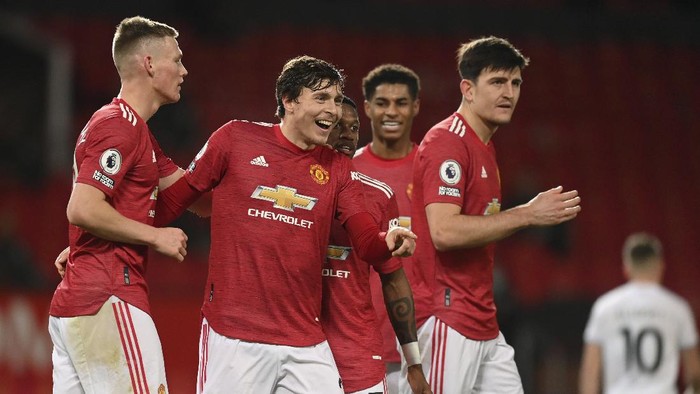 Manchester Uniteds Victor Lindelof, 2nd left, celebrates with team mates after scoring his sides fourth goal during an English Premier League soccer match between Manchester United and Leeds United at the Old Trafford stadium in Manchester, England, Sunday Dec. 20, 2020. (Michael Regan/Pool via AP)