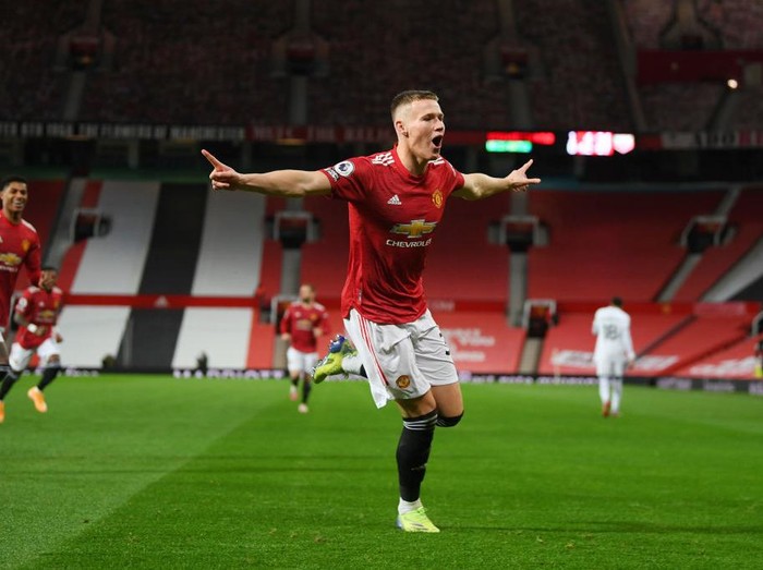 MANCHESTER, ENGLAND - DECEMBER 20: Scott McTominay of Manchester United celebrates after scoring their sides second goal during the Premier League match between Manchester United and Leeds United at Old Trafford on December 20, 2020 in Manchester, England. The match will be played without fans, behind closed doors as a Covid-19 precaution. (Photo by Michael Regan/Getty Images)