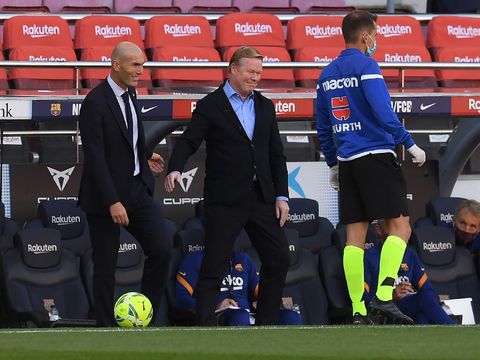 BARCELONA, SPAIN - OCTOBER 24: Zinedine Zidane, Head Coach of Real Madrid interacts with Ronald Koeman, Head Coach of Barcelona ahead of the La Liga Santander match between FC Barcelona and Real Madrid at Camp Nou on October 24, 2020 in Barcelona, Spain. Sporting stadiums around Spain remain under strict restrictions due to the Coronavirus Pandemic as Government social distancing laws prohibit fans inside venues resulting in games being played behind closed doors. (Photo by Alex Caparros/Getty Images)