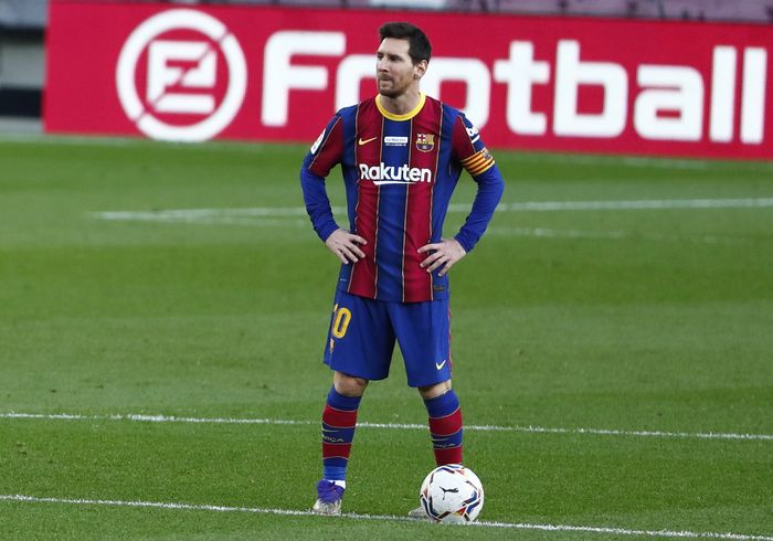 Messi Barcelonas Lionel Messi waits in the centre circle to restart the match after Valencia scored the opening goal of the game during the Spanish La Liga soccer match between Barcelona and Valencia at the Camp Nou stadium in Barcelona, Spain, Saturday, Dec. 19, 2020. (AP Photo/Joan Monfort)
