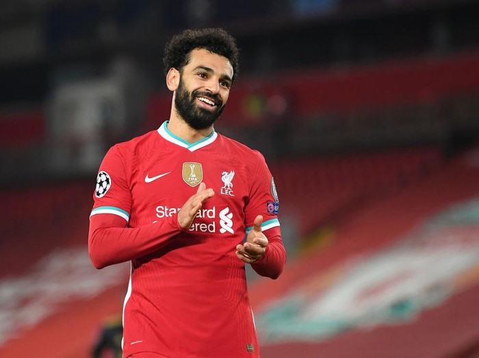 LIVERPOOL, ENGLAND - DECEMBER 01: Mohamed Salah of Liverpool reacts during the UEFA Champions League Group D stage match between Liverpool FC and Ajax Amsterdam at Anfield on December 01, 2020 in Liverpool, England. Sporting stadiums around the UK remain under strict restrictions due to the Coronavirus Pandemic as Government social distancing laws prohibit fans inside venues resulting in games being played behind closed doors. (Photo by Michael Regan/Getty Images)