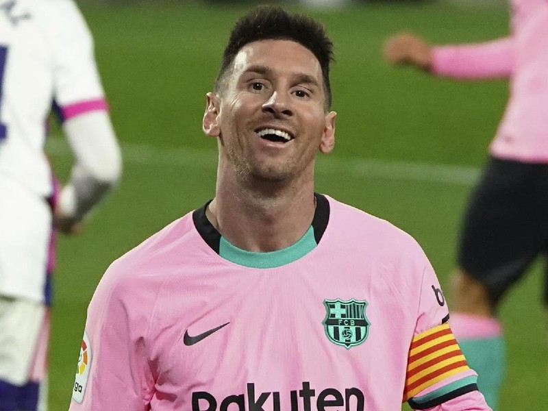 Barcelona's Lionel Messi smiles during a Spanish La Liga soccer match between Valladolid and Barcelona at the Jose Zorrilla stadium in Valladolid, Spain,Tuesday Dec. 22, 2020. (Cesar Manso/Pool via AP)