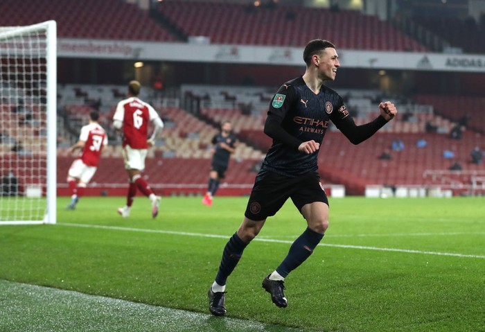 LONDON, ENGLAND - DECEMBER 22: Phil Foden of Manchester City celebrates after scoring their teams third goal during the Carabao Cup Quarter Final match between Arsenal and Manchester City at Emirates Stadium on December 22, 2020 in London, England. The match will be played without fans, behind closed doors as a Covid-19 precaution. (Photo by Catherine Ivill/Getty Images)
