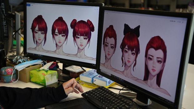 In this photo taken on November 12, 2020, an animator works on hairstyles for a virtual idol at the Beijing Mizhi Tech offices in Beijing. - Although the virtual idol concept originated in Japan, these digital avatars are now stealing airtime in China, where they appear on TV shows, billboards and even news programmes. (Photo by GREG BAKER / AFP) / To go with AFP story China-technology-entertainment, FOCUS by Helen ROXBURGH with Danni ZHU