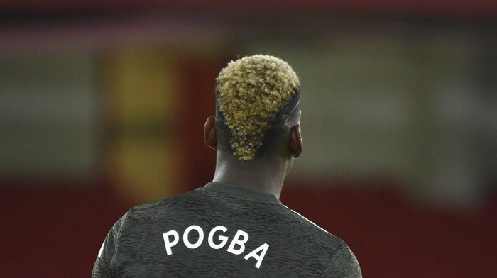 Manchester Uniteds Paul Pogba during the English Premier League soccer match between Sheffield United and Manchester United at the Bramall Lane stadium in Sheffield, England, Thursday, Dec. 17, 2020. Manchester United won the match 3-2.(AP Photo/Rui Vieira, Pool)
