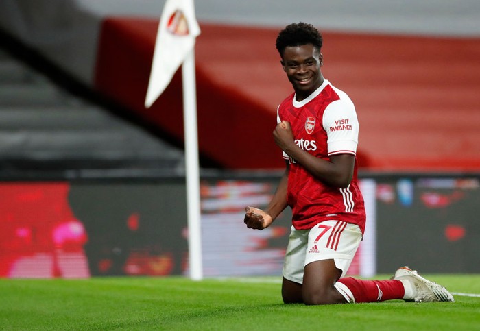 Bukayo Saka LONDON, ENGLAND - DECEMBER 26: Bukayo Saka of Arsenal celebrates after scoring his team's third goal during the Premier League match between Arsenal and Chelsea at Emirates Stadium on December 26, 2020 in London, England. The match will be played without fans, behind closed doors as a Covid-19 precaution. (Photo by Andrew Boyers - Pool/Getty Images)