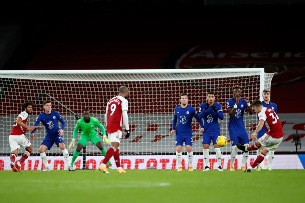 LONDON, ENGLAND - DECEMBER 26: Arsenal's Granit Xhaka crosses the ball during the Premier League match between Arsenal and Chelsea at Emirates Stadium on December 26, 2020 in London, England.  The game will be played without fans, behind closed doors as a Covid-19 precautionary measure.  (Photo by Adrian Dennis - Pool / Getty Images)