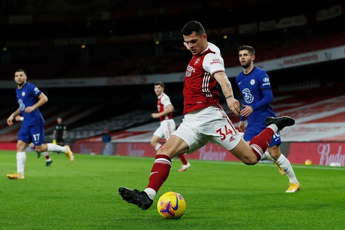 LONDON, ENGLAND - DECEMBER 26: Granit Xhaka of Arsenal crosses the ball during the Premier League match between Arsenal and Chelsea at Emirates Stadium on December 26, 2020 in London, England. The match will be played without fans, behind closed doors as a Covid-19 precaution. (Photo by Adrian Dennis - Pool/Getty Images)