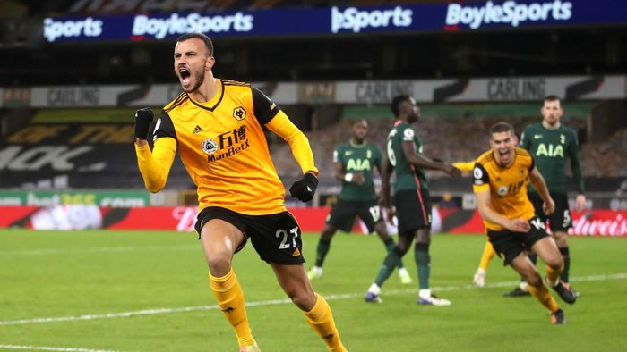 WOLVERHAMPTON, ENGLAND - DECEMBER 27:  Romain Saiss of Wolverhampton Wanderers celebrates after scoring their teams first goal during the Premier League match between Wolverhampton Wanderers and Tottenham Hotspur at Molineux on December 27, 2020 in Wolverhampton, England. The match will be played without fans, behind closed doors as a Covid-19 precaution. (Photo by Carl Recine - Pool/Getty Images)