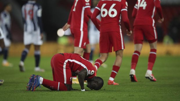 Liverpool's Sadio Mane celebrates after scoring his side's opening goal during an English Premier League soccer match between Liverpool and West Bromwich Albion at the Anfield stadium in Liverpool, England, Sunday Dec. 27, 2020. (Nick Potts/Pool via AP)