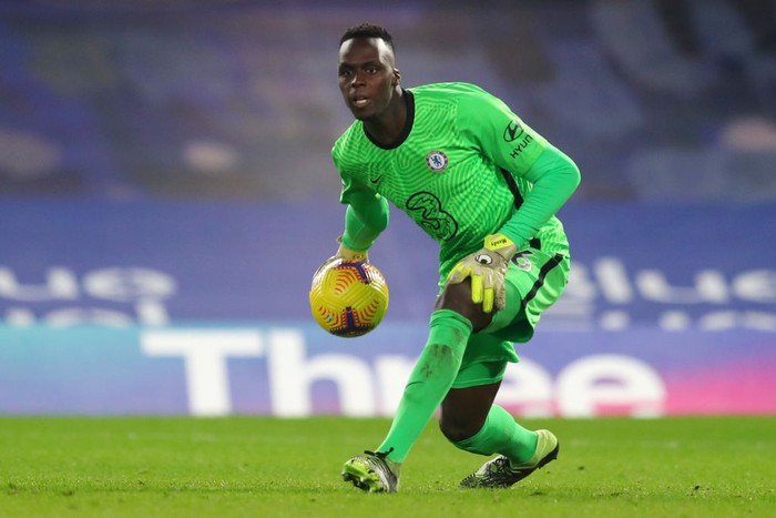 LONDON, ENGLAND - DECEMBER 28: Edouard Mendy of Chelsea rolls the ball during the Premier League match between Chelsea and Aston Villa at Stamford Bridge on December 28, 2020 in London, England. The match will be played without fans, behind closed doors as a Covid-19 precaution. (Photo by Catherine Ivill/Getty Images)