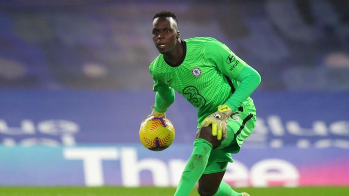 LONDON, ENGLAND - DECEMBER 28: Edouard Mendy of Chelsea rolls the ball during the Premier League match between Chelsea and Aston Villa at Stamford Bridge on December 28, 2020 in London, England. The match will be played without fans, behind closed doors as a Covid-19 precaution. (Photo by Catherine Ivill/Getty Images)