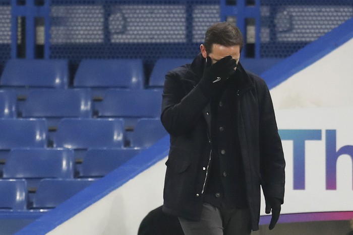Chelseas head coach Frank Lampard covers his face during the English Premier League soccer match between Chelsea and Aston Villa in London, England, Monday, Dec. 28, 2020. (Catherine Ivill/Pool via AP)