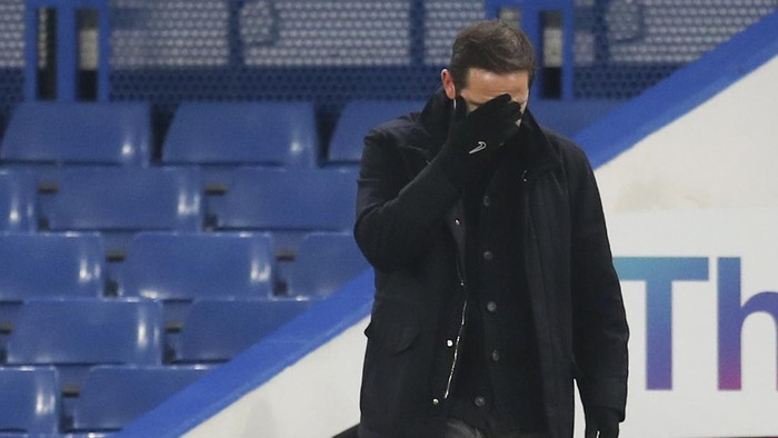 Chelseas head coach Frank Lampard covers his face during the English Premier League soccer match between Chelsea and Aston Villa in London, England, Monday, Dec. 28, 2020. (Catherine Ivill/Pool via AP)
