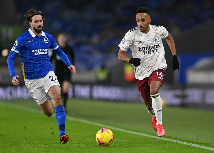 BRIGHTON, ENGLAND - DECEMBER 29: Pierre-Emerick Aubameyang of Arsenal is challenged by Davy Propper of Brighton & Hove Albion during the Premier League match between Brighton & Hove Albion and Arsenal at American Express Community Stadium on December 29, 2020 in Brighton, England. The match will be played without fans, behind closed doors as a Covid-19 precaution. (Photo by Neil Hall - Pool/Getty Images)