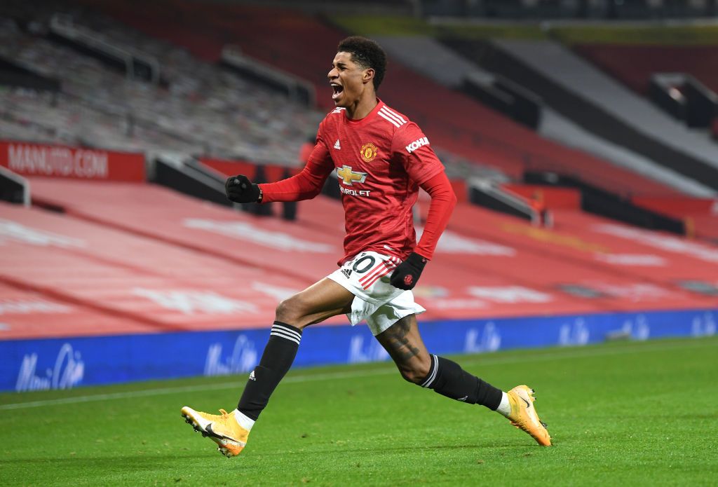 MANCHESTER, ENGLAND - DECEMBER 29: Marcus Rashford of Manchester United celebrates after scoring his team's first goal during the Premier League match between Manchester United and Wolverhampton Wanderers at Old Trafford on December 29, 2020 in Manchester, England. The match will be played without fans, behind closed doors as a Covid-19 precaution. (Photo by Michael Regan/Getty Images)