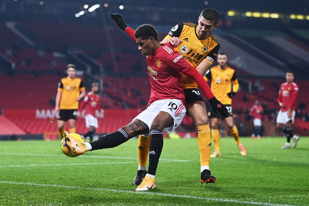 MANCHESTER, ENGLAND - DECEMBER 29: Marcus Rashford of Manchester United celebrates after scoring his team's first goal during the Premier League match between Manchester United and Wolverhampton Wanderers at Old Trafford on December 29, 2020 in Manchester, England. The match will be played without fans, behind closed doors as a Covid-19 precaution. (Photo by Michael Regan/Getty Images)