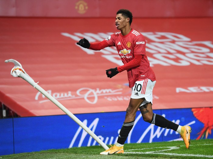 MANCHESTER, ENGLAND - DECEMBER 29: Marcus Rashford of Manchester United celebrates after scoring his teams first goal during the Premier League match between Manchester United and Wolverhampton Wanderers at Old Trafford on December 29, 2020 in Manchester, England. The match will be played without fans, behind closed doors as a Covid-19 precaution. (Photo by Michael Regan/Getty Images)