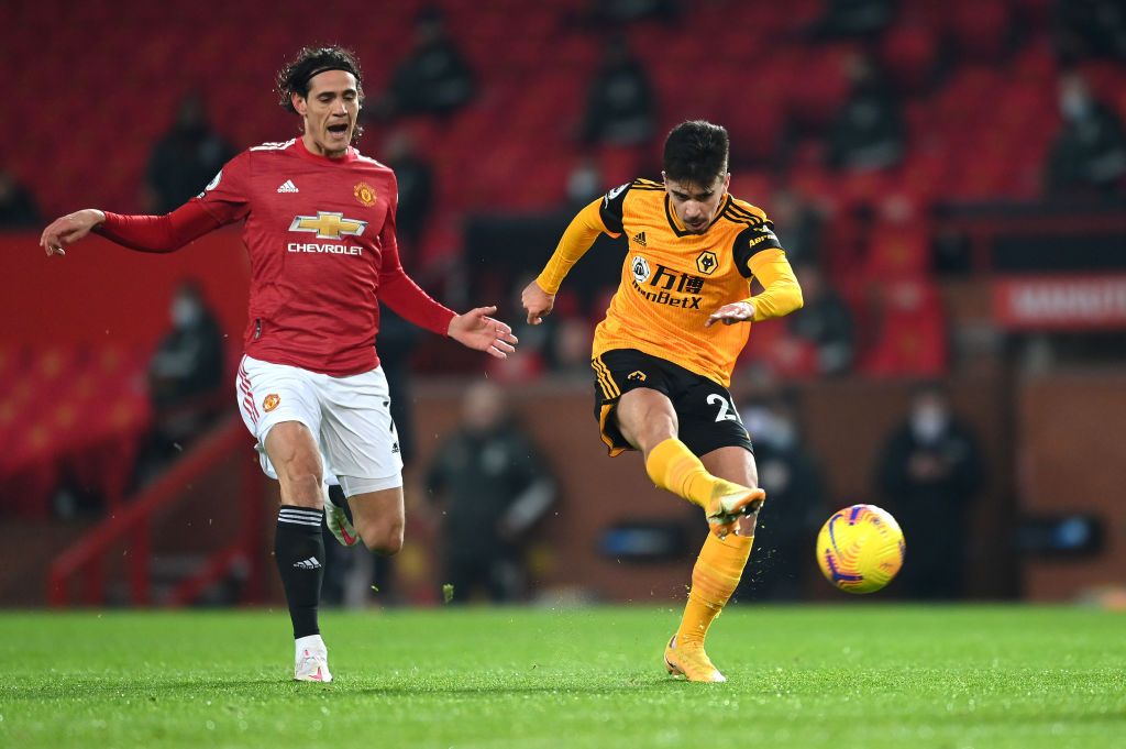 MANCHESTER, ENGLAND - DECEMBER 29: Manchester United's Paul Pogba controls the ball under pressure from Vitinha of Wolverhampton Wanderers during the Premier League match between Manchester United and Wolverhampton Wanderers at Old Trafford on December 29, 2020 in Manchester, England .  The game will be played without fans, behind closed doors as a Covid-19 precaution.  (Photo by Michael Regan / Getty Images)