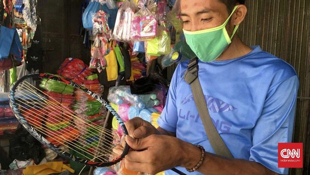 Agus -  Perakit senar raket