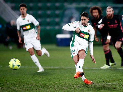 ELCHE, SPAIN - DECEMBER 30: Fidel of Elche scores their team's first goal from the penalty spot during the La Liga Santander match between Elche CF and Real Madrid at Estadio Martinez Valero on December 30, 2020 in Elche, Spain. Sporting stadiums around Spain remain under strict restrictions due to the Coronavirus Pandemic as Government social distancing laws prohibit fans inside venues resulting in games being played behind closed doors. (Photo by Eric Alonso/Getty Images)