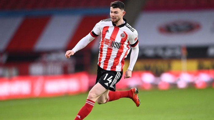 SHEFFIELD, ENGLAND - DECEMBER 06: Oliver Burke of Sheffield United runs with the ball during the Premier League match between Sheffield United and Leicester City at Bramall Lane on December 06, 2020 in Sheffield, England. (Photo by Laurence Griffiths/Getty Images)