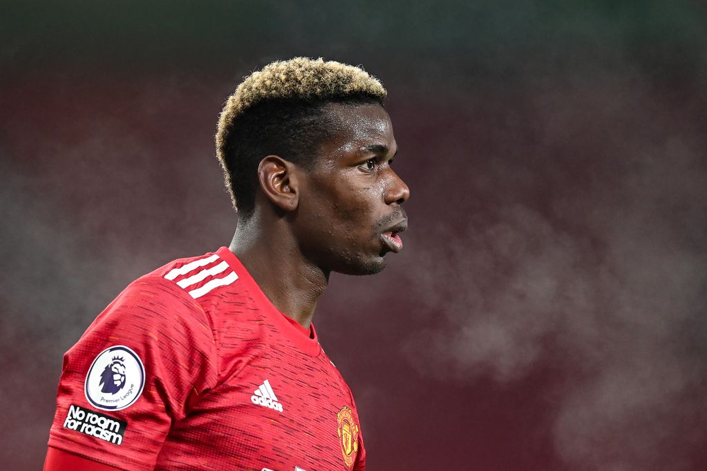MANCHESTER, ENGLAND - DECEMBER 29: Paul Pogba of Manchester United in action during the Premier League match between Manchester United and Wolverhampton Wanderers at Old Trafford on December 29, 2020 in Manchester, England. The match will be played without fans, behind closed doors as a Covid-19 precaution. (Photo by Michael Regan/Getty Images)