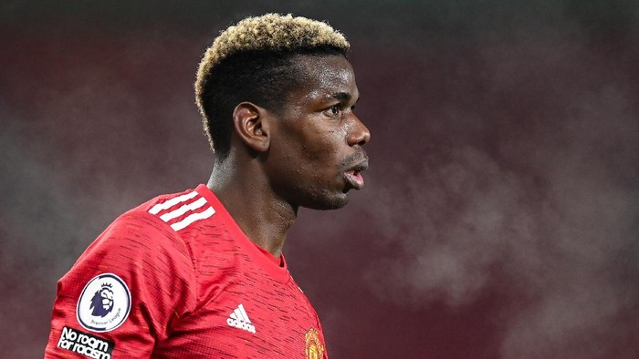 MANCHESTER, ENGLAND - DECEMBER 29: Paul Pogba of Manchester United in action during the Premier League match between Manchester United and Wolverhampton Wanderers at Old Trafford on December 29, 2020 in Manchester, England. The match will be played without fans, behind closed doors as a Covid-19 precaution. (Photo by Michael Regan/Getty Images)