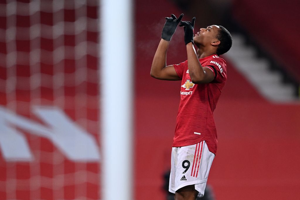 MANCHESTER, ENGLAND - JANUARY 01: Anthony Martial of Manchester United celebrates after scoring their team's first goal during the Premier League match between Manchester United and Aston Villa at Old Trafford on January 01, 2021 in Manchester, England. The match will be played without fans, behind closed doors as a Covid-19 precaution. (Photo by Laurence Griffiths/Getty Images)