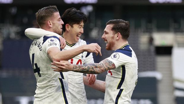 Tottenham's Toby Alderweireld, left, celebrates with teammates after scoring his side's third goal during the English Premier League soccer match between Tottenham Hotspur and Leeds United at Tottenham Hotspur Stadium in London, England, Saturday, Jan. 2, 2021. (AP Photo/Ian Walton, Pool)
