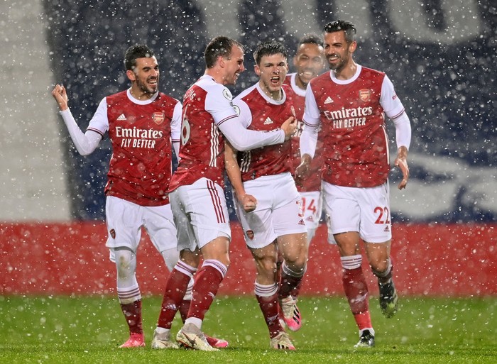 WEST BROMWICH, ENGLAND - JANUARY 02: Kieran Tierney of Arsenal celebrates with teammates Rob Holding, Dani Ceballos and Pablo Mari after scoring their teams first goal during the Premier League match between West Bromwich Albion and Arsenal at The Hawthorns on January 02, 2021 in West Bromwich, England. The match will be played without fans, behind closed doors as a Covid-19 precaution. (Photo by Michael Regan/Getty Images)