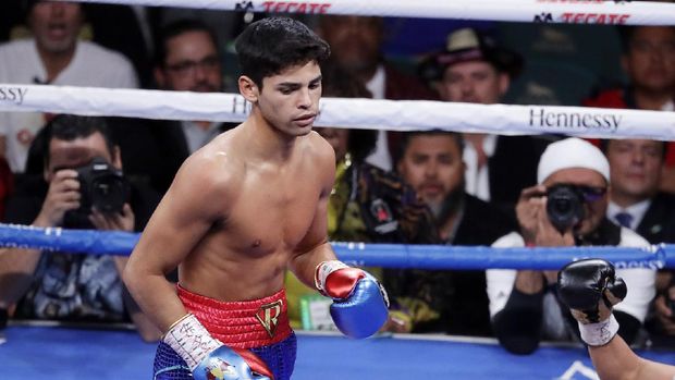 FILE - In this Nov. 2, 2019 file photo, Ryan Garcia, looks on after landing a punch to Romero Duno (not seen) during their lightweight boxing match in Las Vegas.   Garcia meets Britain’s Luke Campbell, a 2012 Olympic champion, in an interim WBC lightweight title fight. The bout was postponed a month and moved from California after Campbell tested positive for COVID-19.(AP Photo/Isaac Brekken, File)