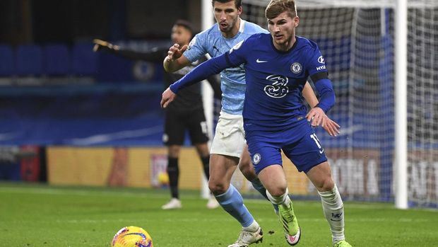 Manchester City's Ruben Dias, left, and Chelsea's Timo Werner challenge for the ball during the English Premier League soccer match between Chelsea and Manchester City at Stamford Bridge, London, England, Sunday, Jan. 3, 2021. (Shaun Botterill/Pool via AP)